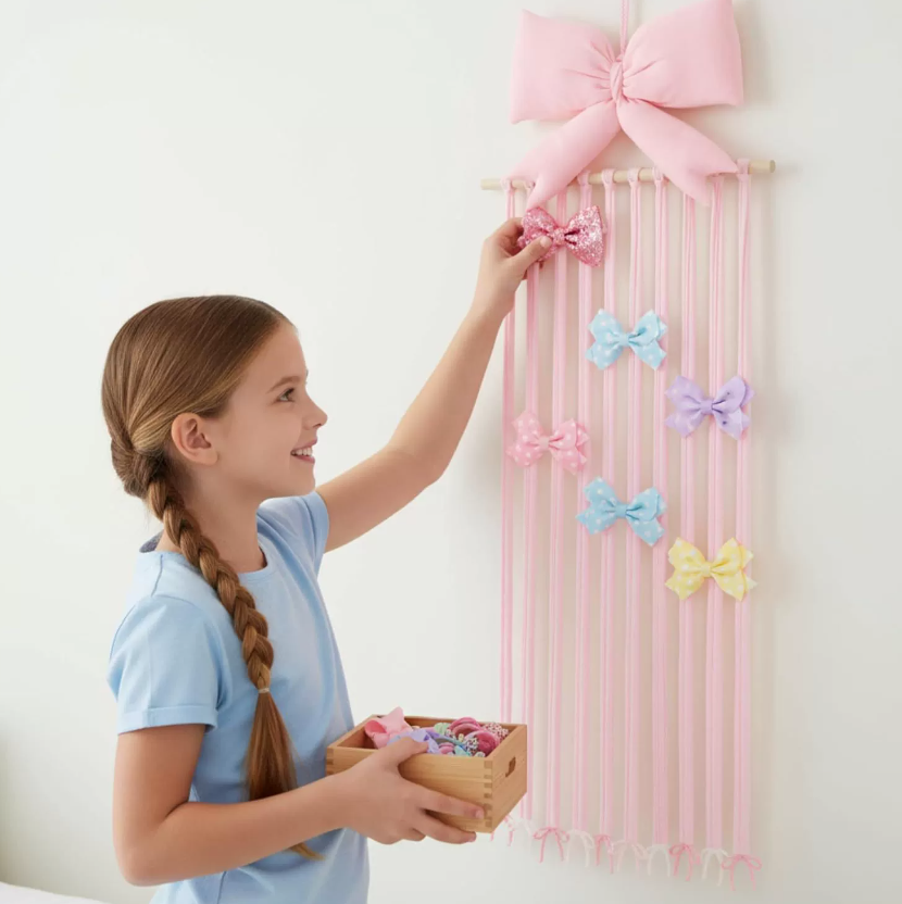 Organizador colgante para pinzas de pelo con diseño de lazo rosa